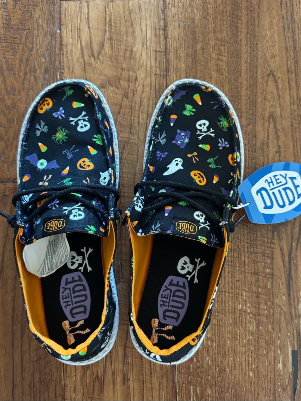 Hey Dude Women’s Black Halloween Print Slip-On Sneakers with Orange Trim